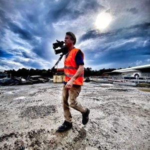 Freelance cameraman in Stockholm filming on a large construction site for an industrial video production.